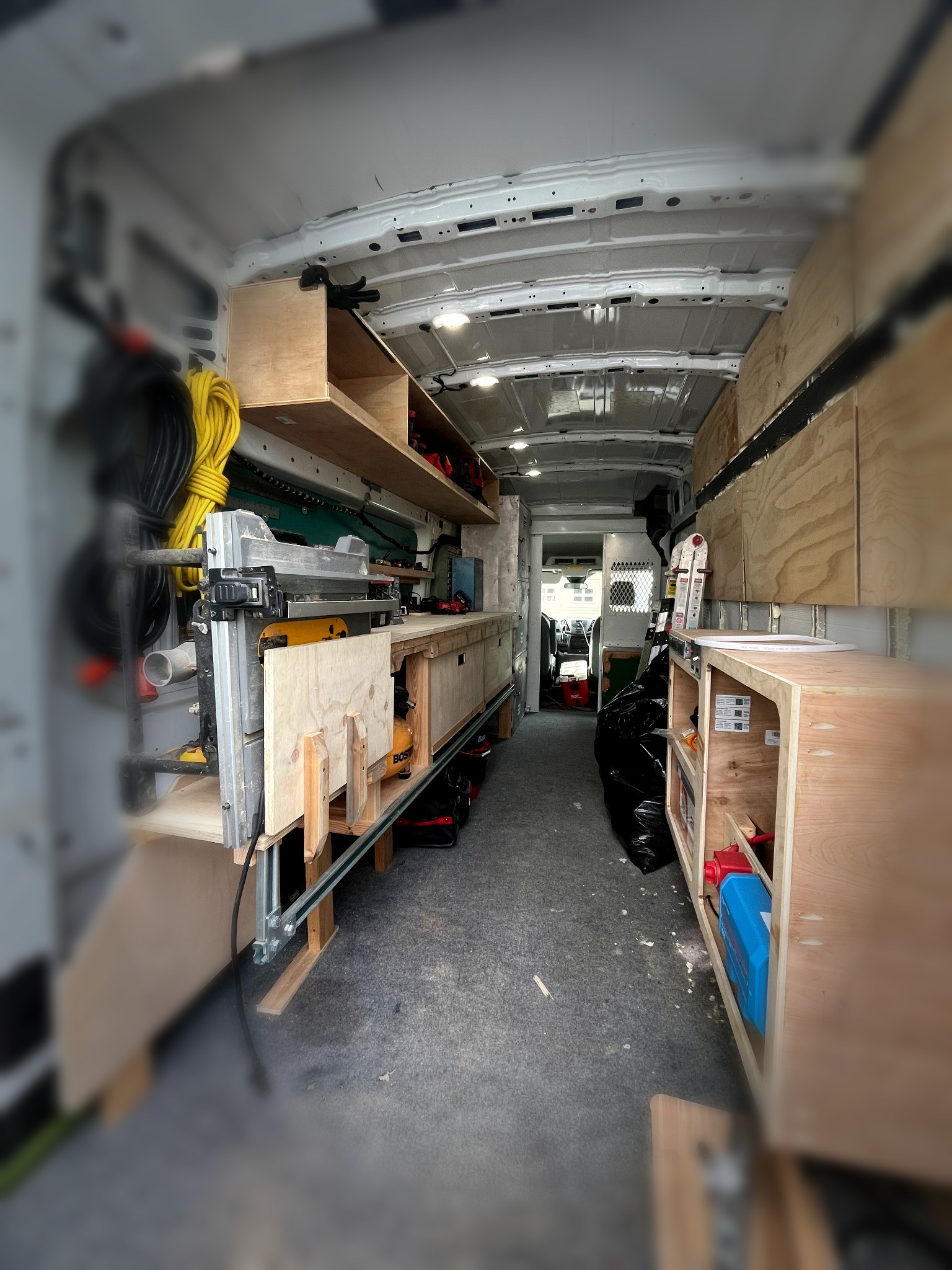 Service van interior with shelving and organized workspace